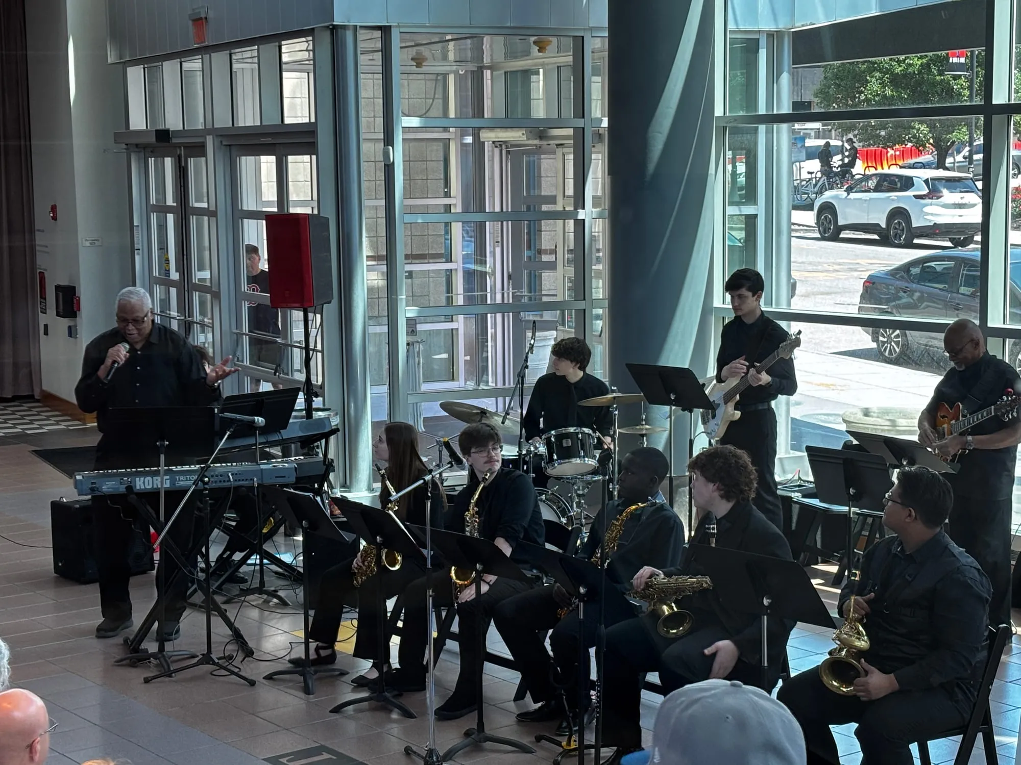 The Williams Combo performs, a student on vibraphone alongside saxophonists by tall windows.